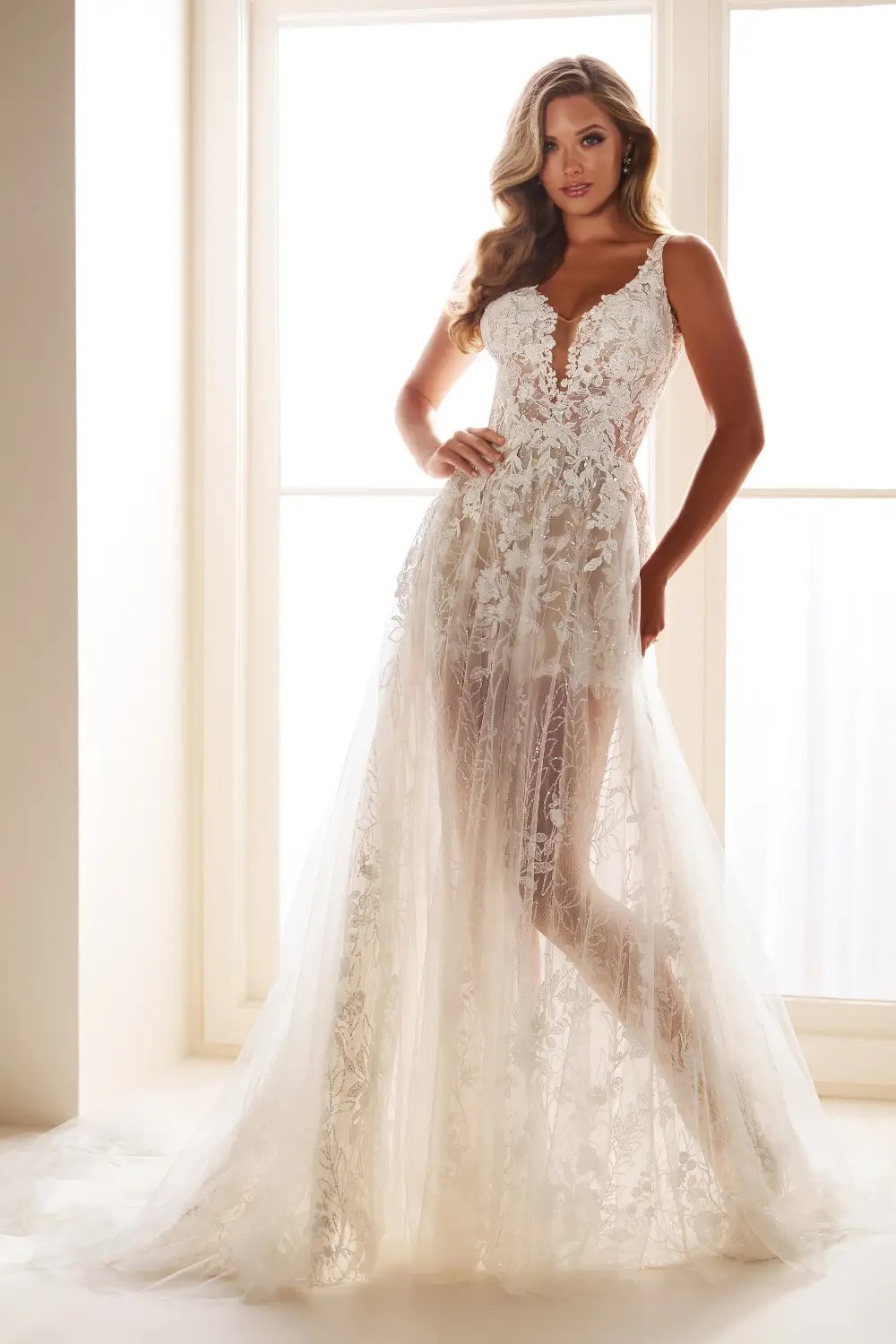 Pure romance from every angle—this A-line gown dazzles all day long Style No. E609 $1 autoplay loop mute thumbnail